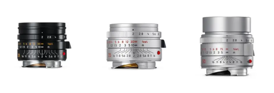 하얀 배경 위에 나란히 놓인 라이카 주미크론 M 렌즈 3종. 왼쪽부터 검은색 28mm, 실버 35mm, 그리고 실버 50mm f/2.0 주미크론 렌즈가 보인다.