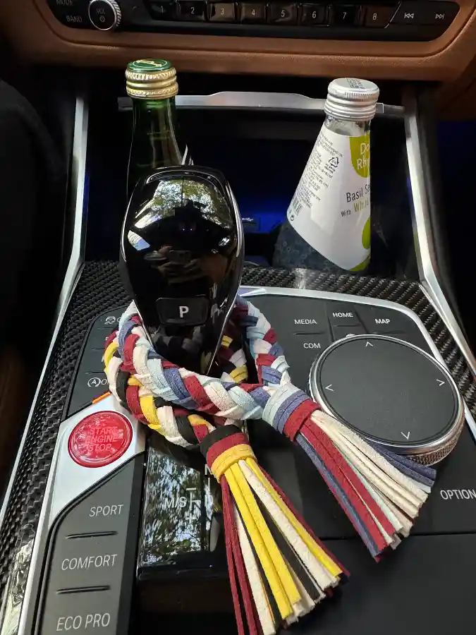 BMW M340i gear knob with colorful M accessory charm (Emzzi) — interior detail by TACO