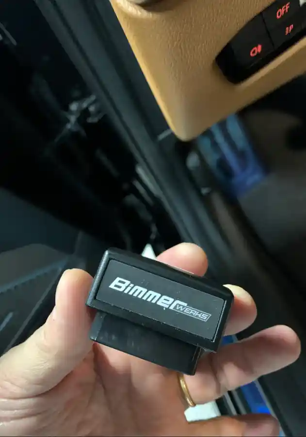 BMW M340i BimmerWerks Easy Access module held in owner's hand — installation detail by TACO