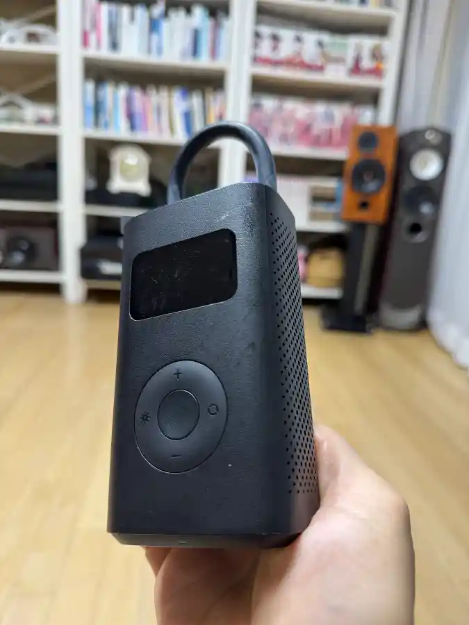 Xiaomi portable wireless air pump held in hand — essential tire maintenance tool for BMW M340i by TACO