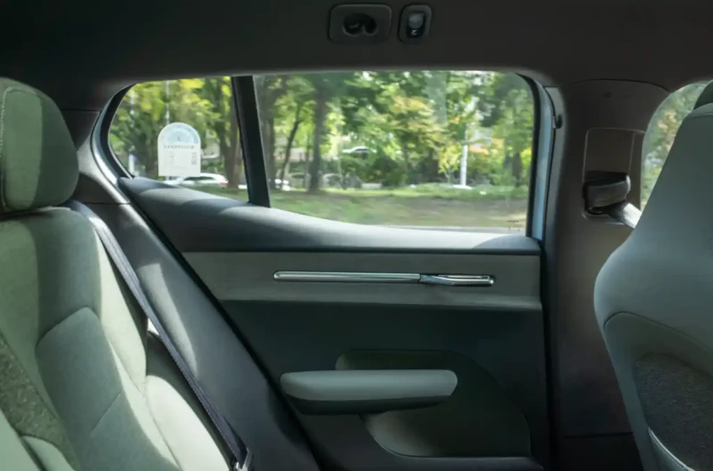 Rear seat side window of Volvo EX30 Cross Country showing thick pillar and limited outward visibility
