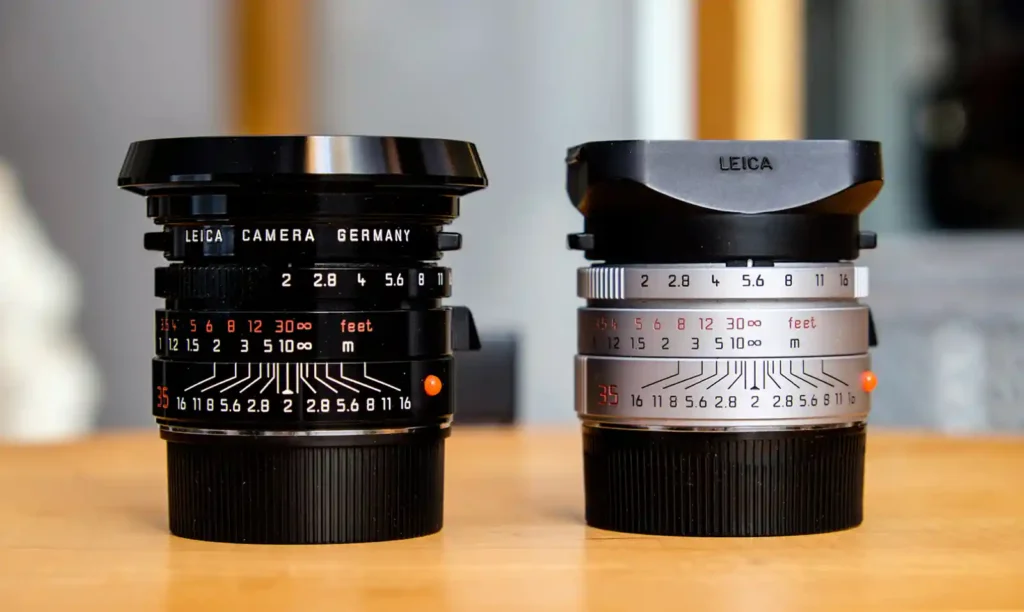 라이카 Summicron 35mm f/2.0 4세대(왼쪽, 블랙)와 5세대 ASPH(오른쪽, 실버)의 비교. 조리개 눈금과 초점거리 표시가 선명하게 보임