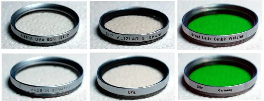 라이카 E39·UVa 필터를 포함한 여러 종류의 빈티지 라이카 M 필터가 테이블 위에 배열된 사진으로, 금속 테두리와 각인된 규격이 잘 보이는 장면