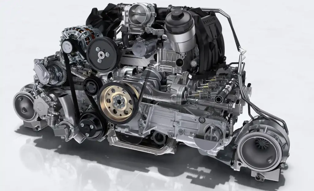포르쉐 수평대향6기통 수랭 플랫식스 엔진 단독 컷 – 좌우로 눕혀진 실린더 배열과 터보차저 구조